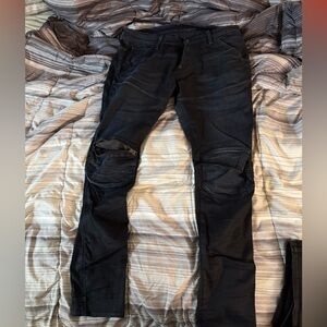 G Star Black zipper knee jeans.